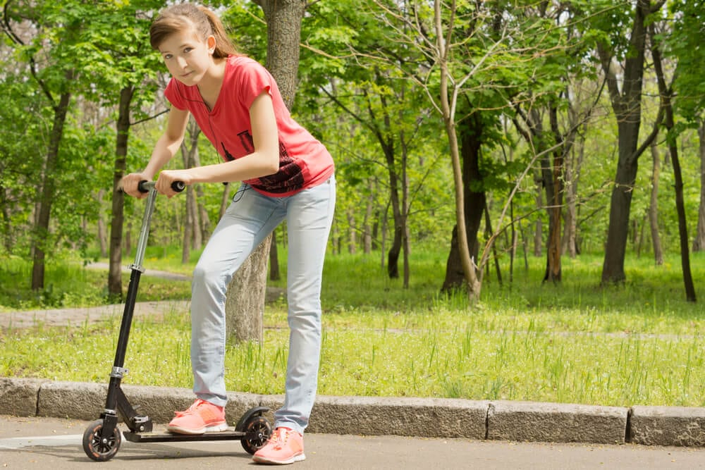 Girl on black scooter