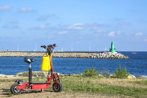 Scooter next to lighthouse