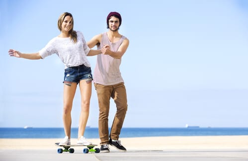 Couple having fun on skateboard