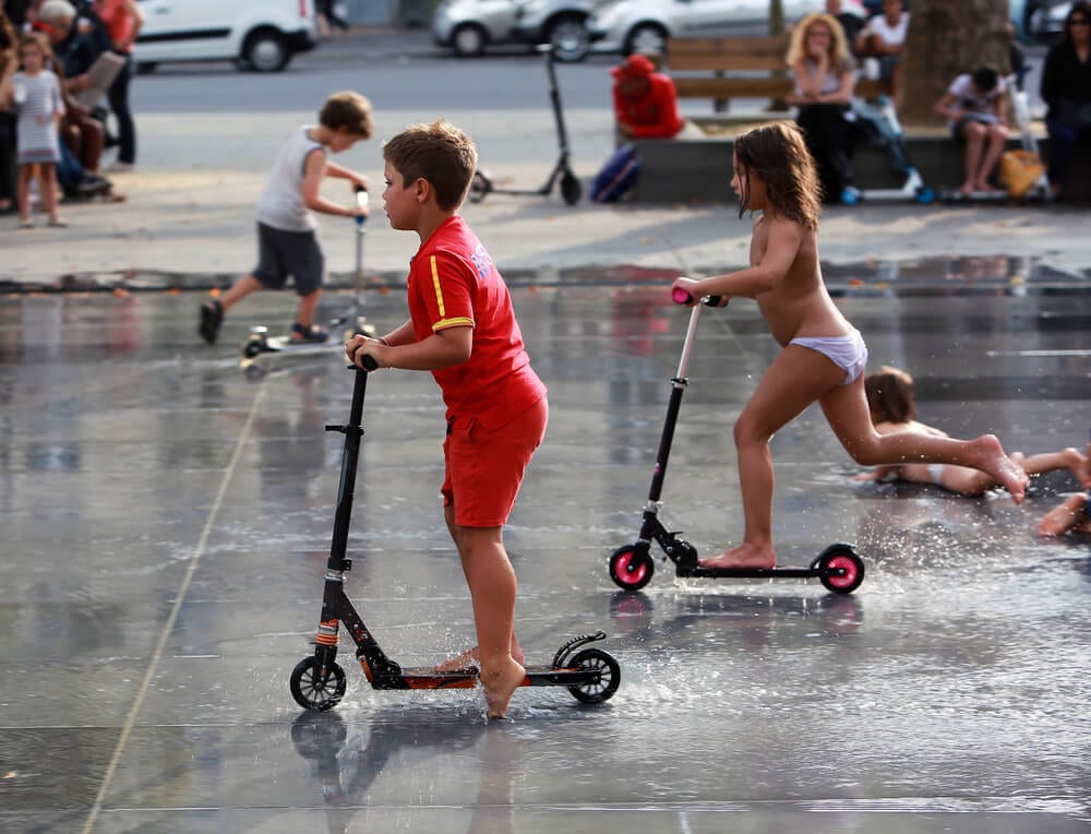 Kids playing on scooters