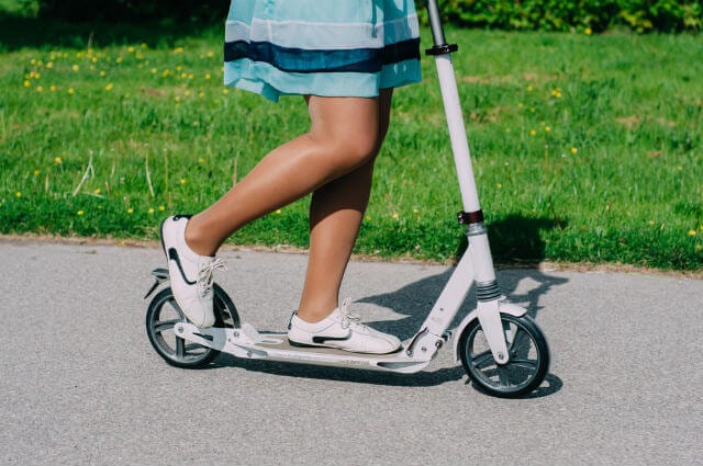 Girl on white scooter